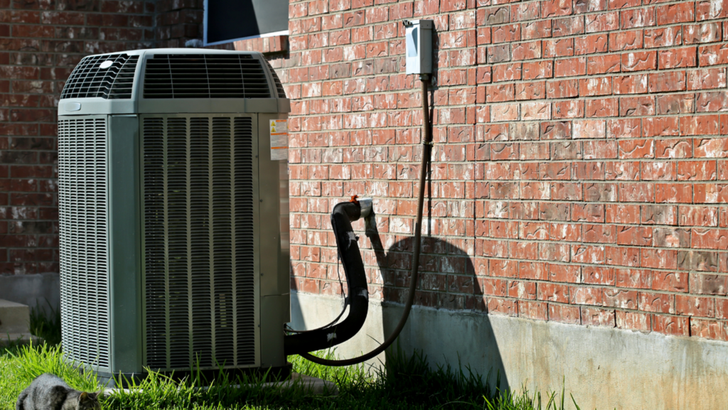 An AC unit is installed outside of a home.