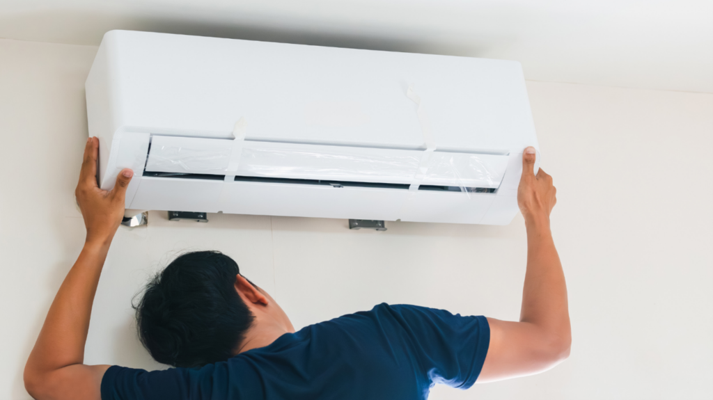 An AC unit is installed onto the wall of a home